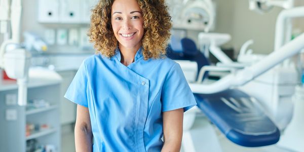 A nurse Inside the dentist room with looking ahead