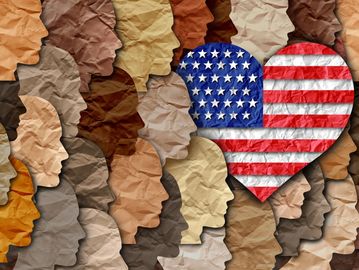 Diverse paper-cut faces with a heart showing the American flag.