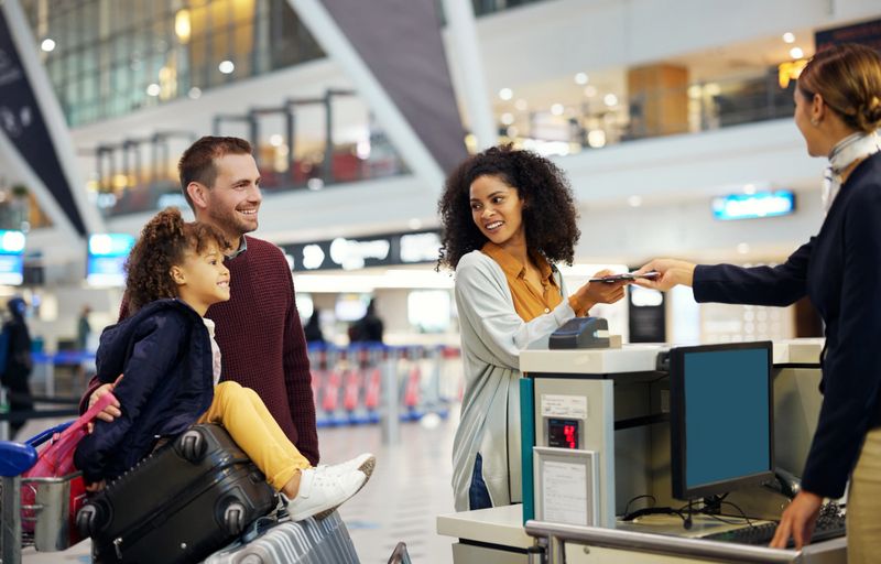Family, travel and holiday, child with parents at airport with happiness, excited and ready for adventure with passport. Happy people, diversity and freedom with vacation abroad, flight and airplane