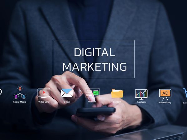 Person using a smartphone with digital marketing icons and text overlay.