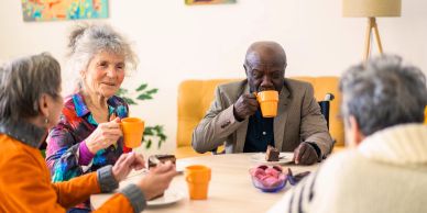 Seniors enjoying coffee and conversation.
