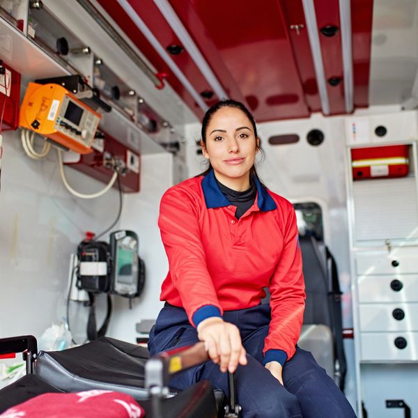 Female paramedic inside an ambulance.