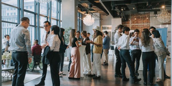 Professionals networking at an indoor event.