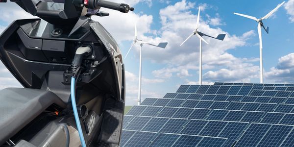 Electricity generated by solar panels and wind turbines and consumed by electric scooters.