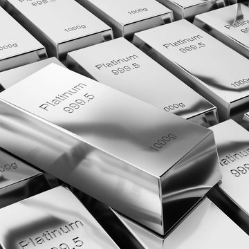 Shiny platinum bars stacked together, each marked 999.5 purity and 1000g weight.