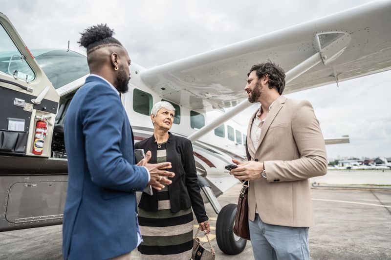Coworkers talking in the airport hangar