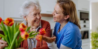 Young woman providing support to a senior