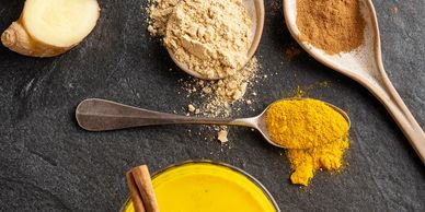 Turmeric milk with cinnamon, ginger, honey, and spices.