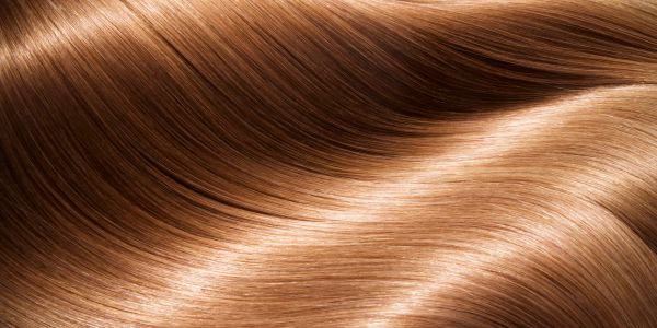 Close-up of smooth, shiny brown hair.