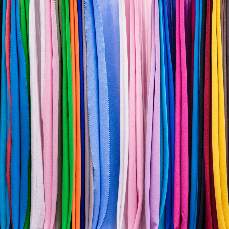 Rainbow colors of samples bright fabrics. Choice of decorative textiles for design