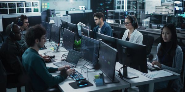Team of programmers working intensely in an office.