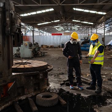 Disaster response team assessing flooded building for rapid recovery and stabilization scope