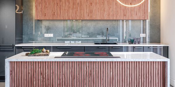 Modern kitchen with wooden textured cabinets and marble countertops.