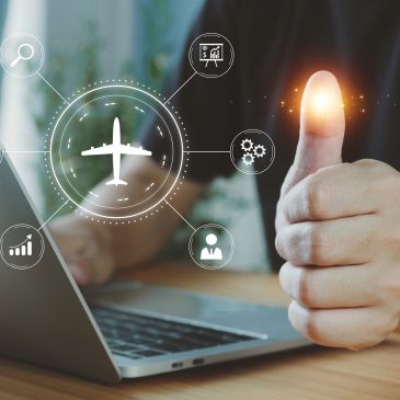 Person giving thumbs up near laptop with airplane infographic.