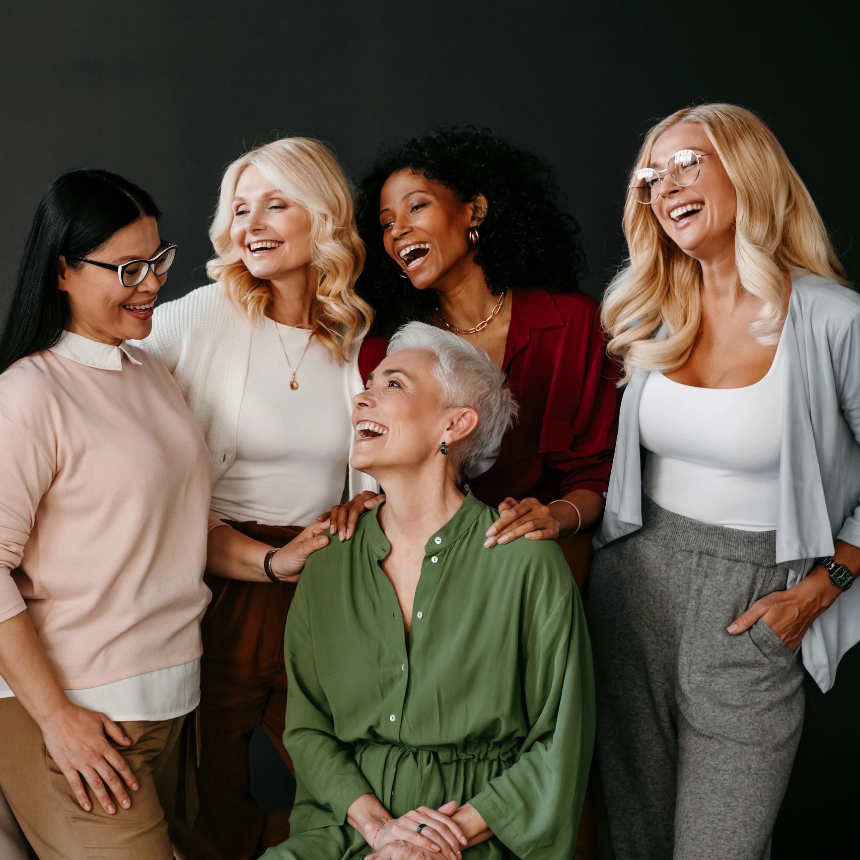Group of diverse women laughing and enjoying each other's company.