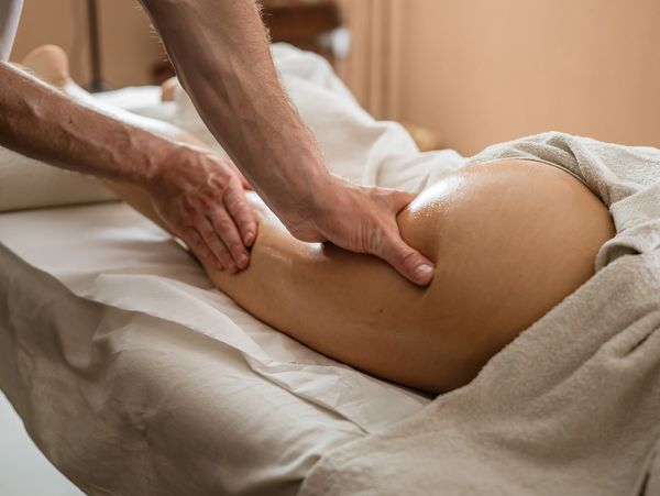 Person receiving a relaxing leg massage.