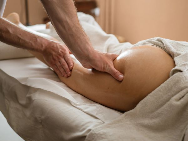 Person receiving a leg massage.