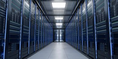 Data center server room with racks of servers.