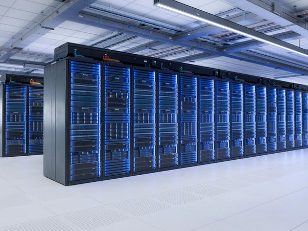 A row of illuminated server racks in a modern data center.