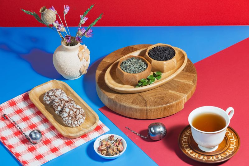 Tea in a cup in a composition with accessories and dessert.