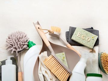 Eco-friendly cleaning supplies with natural brushes and sponges.