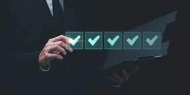 Person marking checkboxes on a virtual interface.