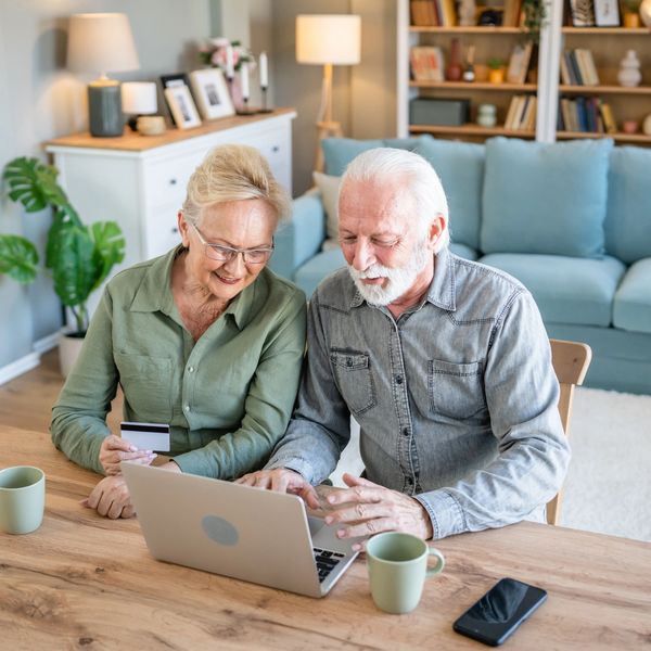 Senior couple looking at a laptop together