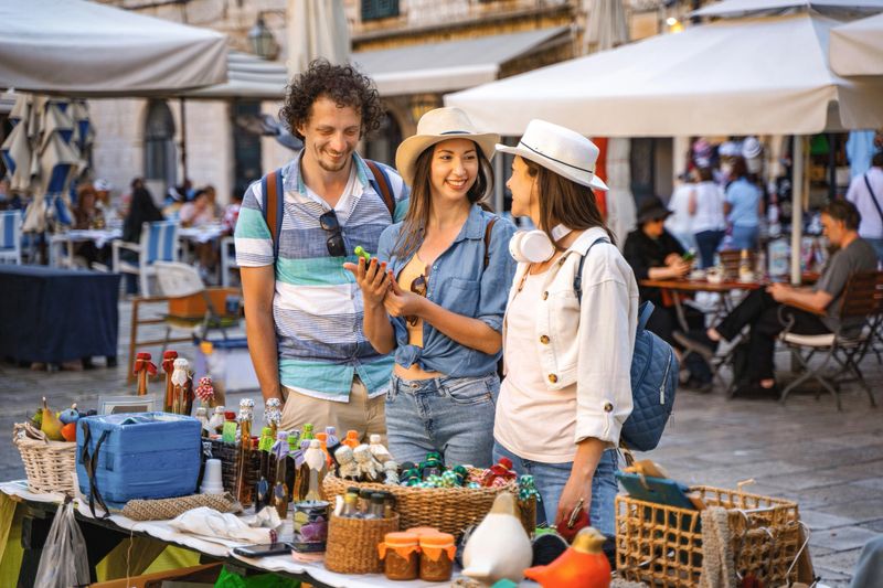 Tourists buying homemade products on the street market