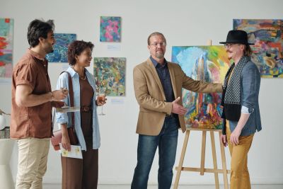 Group enjoying an art presentation at a gallery.