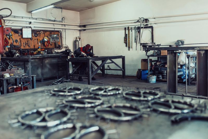 Pieces of steel lined up on the table ready for the welding process.