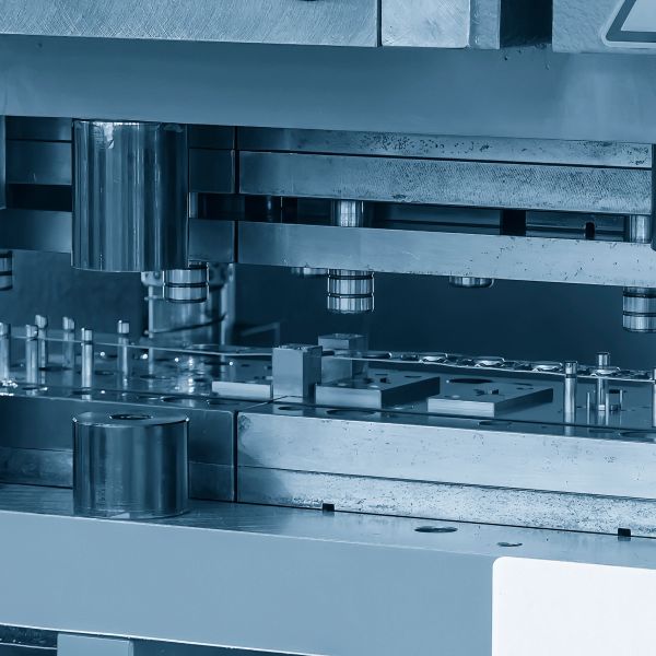 Close-up of a metal machine part in a factory.