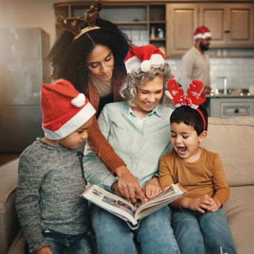 Family enjoying Christmas storytime with festive hats and smiles.