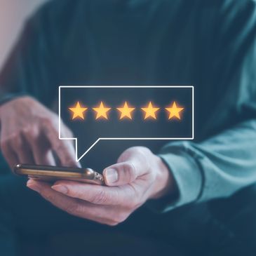 Person giving a five-star rating on a smartphone.