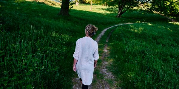Person walking on a forest trail.