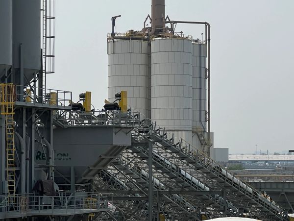 Industrial chemical plant with storage tanks and pipelines.