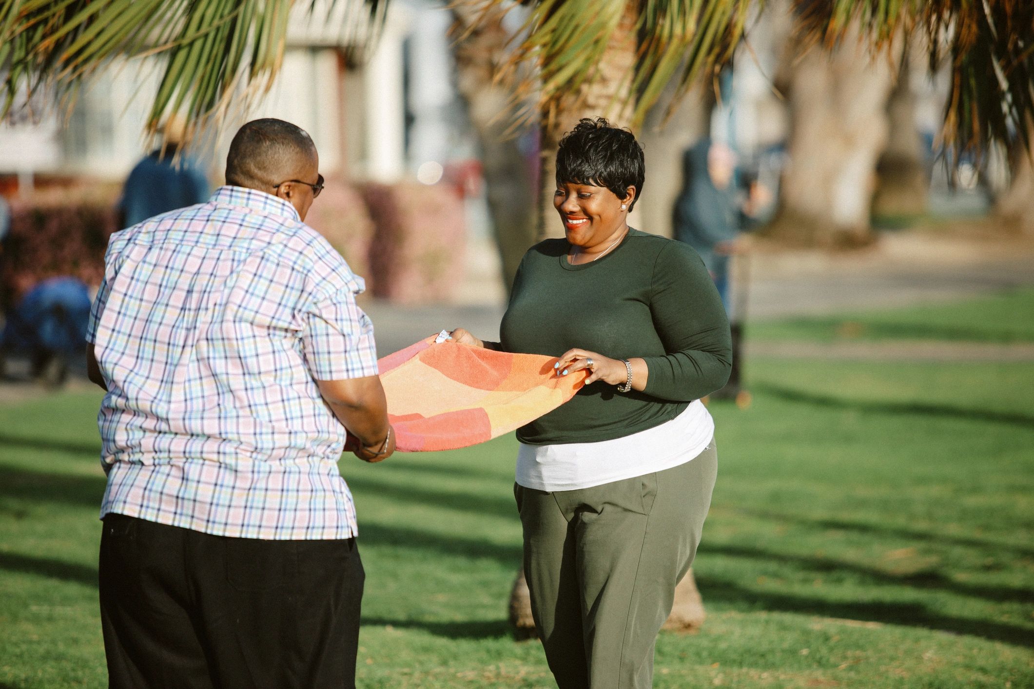 LGBTQ couple enjoying their time together in Santa Monica, LA, going for a casual outdoors picnic.