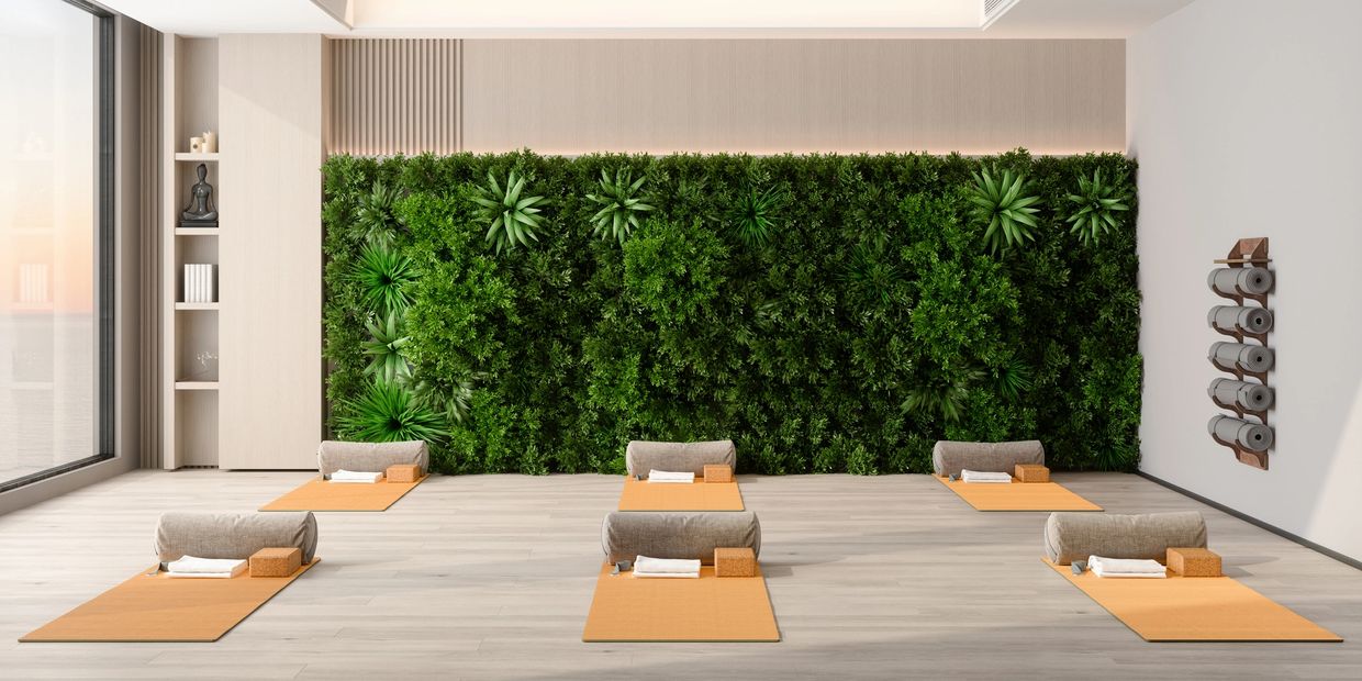 Yoga studio with mats and greenery.