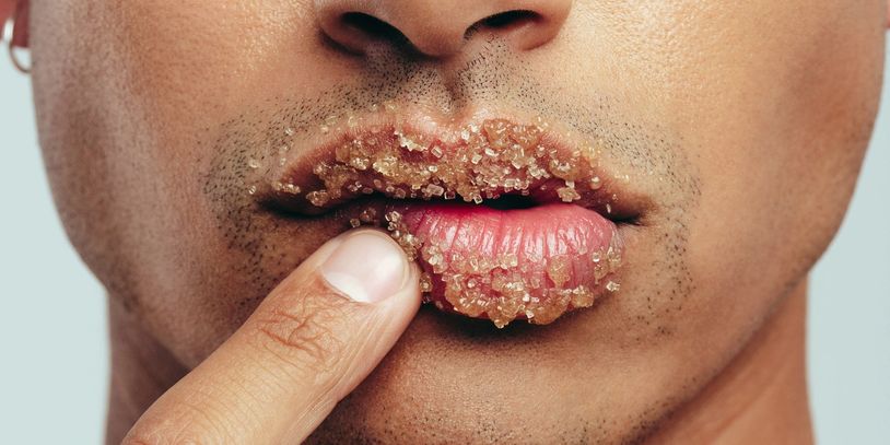 A man with his finger in his mouth.