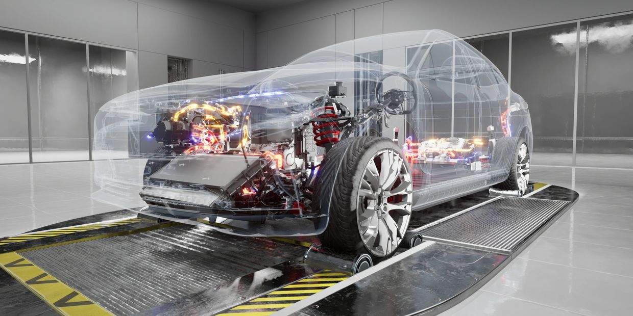 Transparent car model showing intricate electric and mechanical components inside.