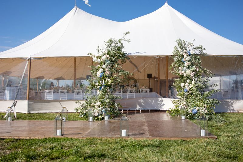 Immerse yourself in the beauty of meticulously designed flower ceremony arrangements featuring enchanting roses, delicate candles, and captivating lighting. Enhance your event reception with stunning floral centerpieces, accompanied by elegant silverware and plates. Experience the romance of a garden-inspired wedding under a picturesque arch adorned with vibrant flowers. Indulge in the sweetness of a beautifully crafted cake adorned with intricate sugar flowers that perfectly complements the event's floral theme. Capture the essence of love and joy through radiant images of a bride holding a breathtaking bouquet of roses and sunflowers. Set a magical atmosphere with bokeh lights casting a romantic glow, while chairs adorned with elegant floral arrangements add charm and sophistication. Bring the beauty of nature indoors with potted plants and lush greenery, transforming your event space into a serene garden oasis. Illuminate your celebration with the warm ambiance of candles, creating an intimate and inviting atmosphere. Celebrate the beauty of sunflowers in a stunning centerpiece that captivates with its vibrant colors and natural charm. Discover the artistry and elegance of floral design, adding a touch of enchantment to weddings, marriages, and engagement events.
