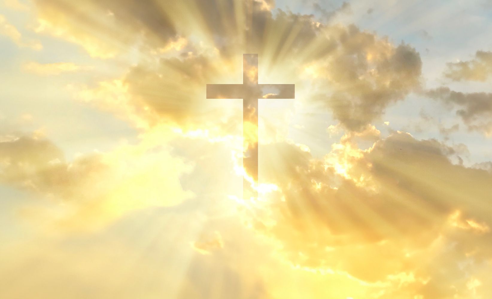 A luminous cross with radiant sunlight and clouds.