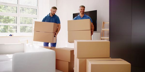 North Point Movers team members moving boxes in a home with care and professionalism.