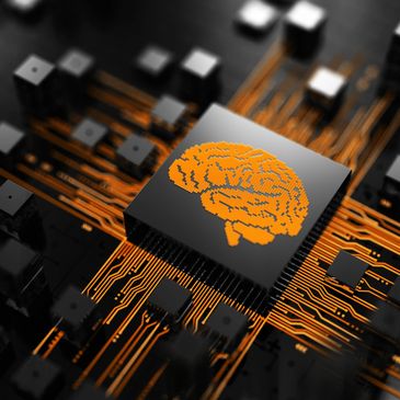 Microchip with an orange brain symbol and circuit lines on a black board.