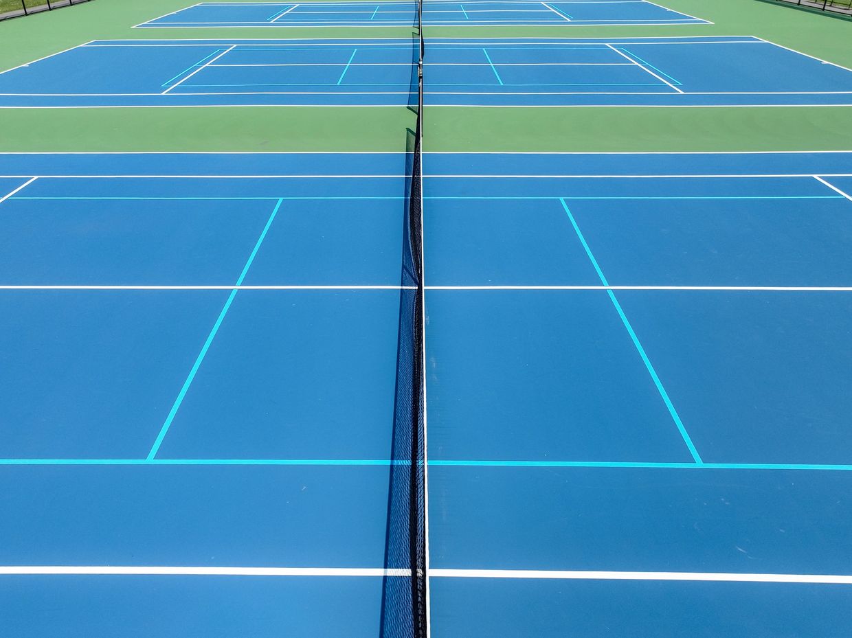New Construction Cushion X Concrete Tennis and Pickleball court with Dominator Basketball goal.