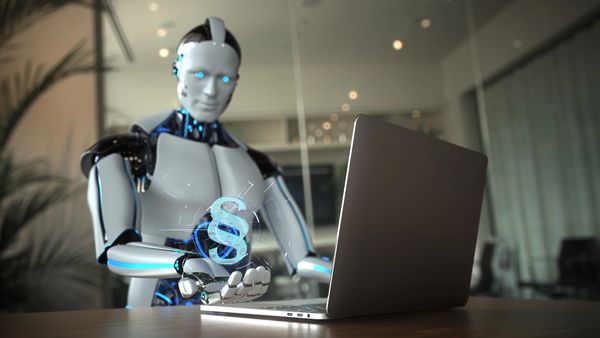 Robot interacting with a laptop and a digital legal icon.