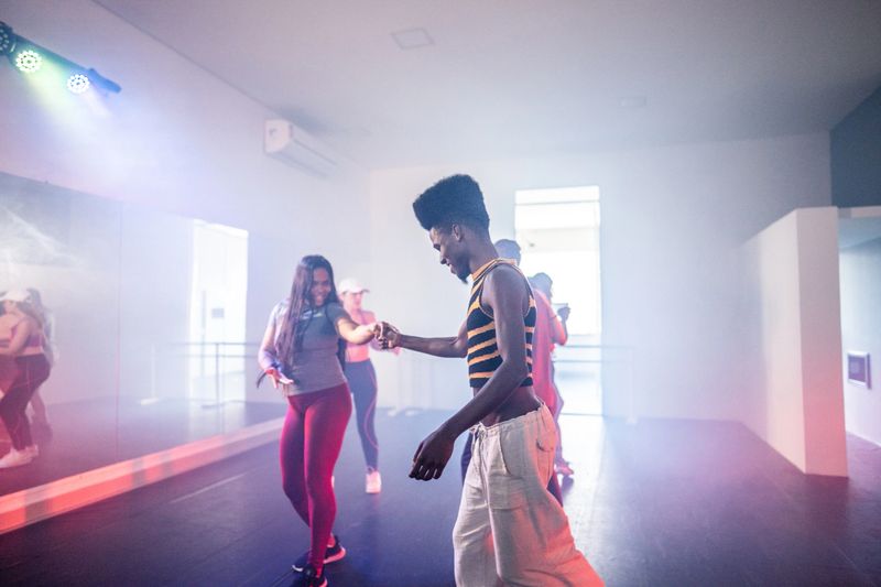 Young friends on a class at dance studio