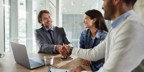 Business handshake sealing a deal in a modern office.