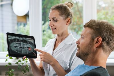 Dentist performing gentle wisdom tooth extraction at Save Dental in Orem, Utah.