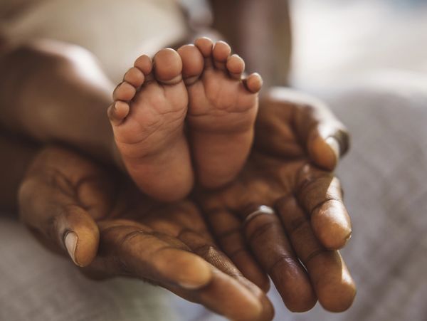 Newborn’s feet held by parent, representing Atlanta birth injury case