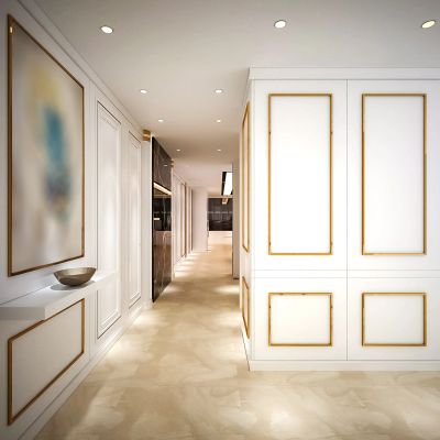 Elegant hallway with white and gold paneling and marble flooring.